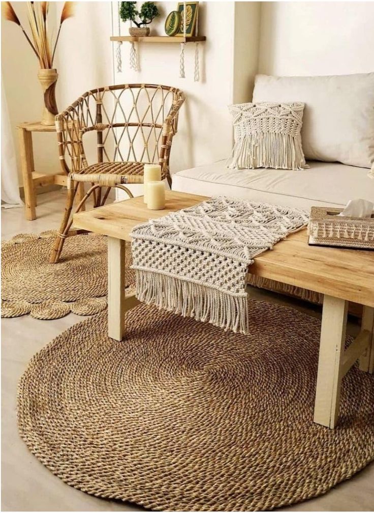 Cozy bohemian living room with rattan chair, woven rugs, wooden table, and macramé decor for a natural, inviting feel.