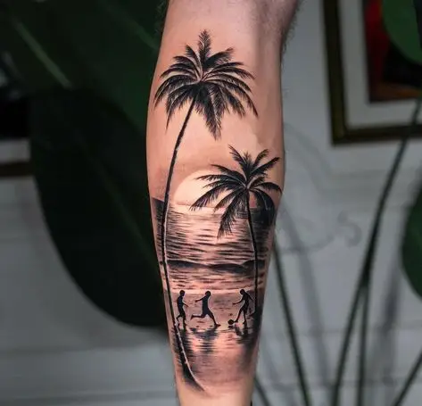 Tattoo of palm trees and sunset beach scene with silhouettes, inked on forearm.