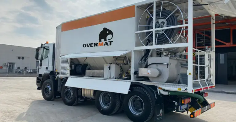 A_-scaled-1396x720 Overmat construction truck parked at industrial site, showcasing machinery and equipment features. | Sky Rye Design Overmat construction truck parked at industrial site, showcasing machinery and equipment features.