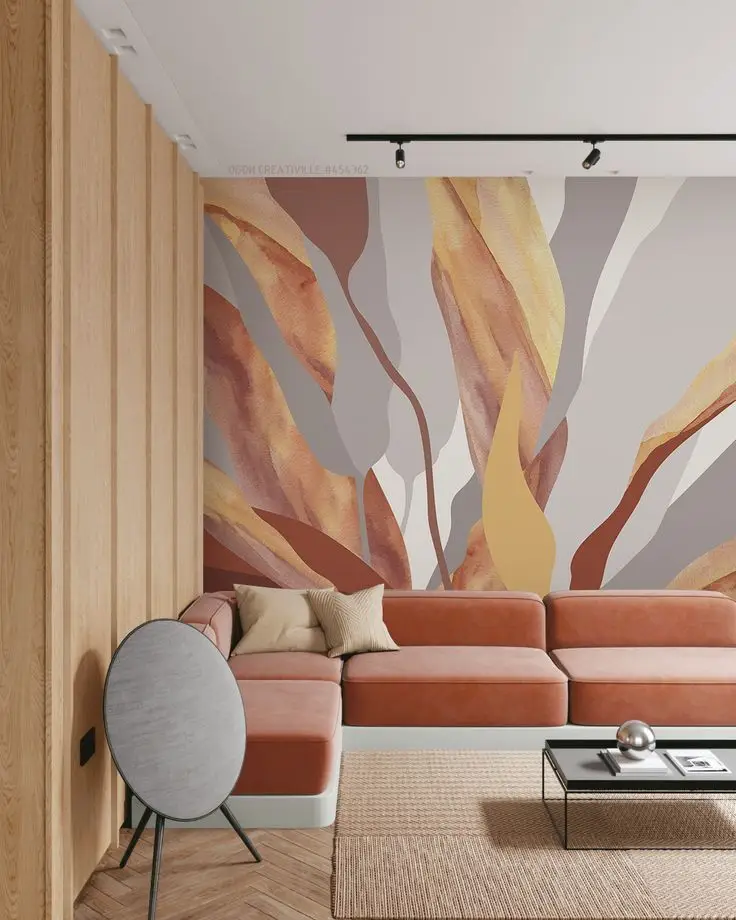 Modern living room with abstract mural, terracotta sofa, wooden accents, and minimalist decor.