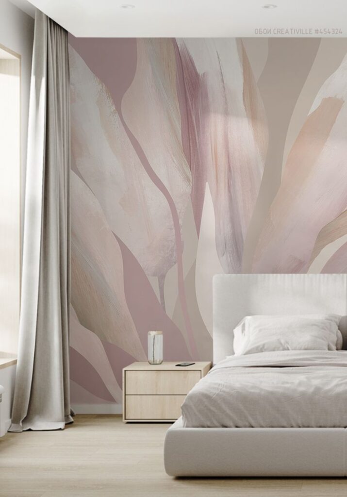 Modern bedroom with abstract pastel wall art, beige bed, and nightstand by a window with curtains.