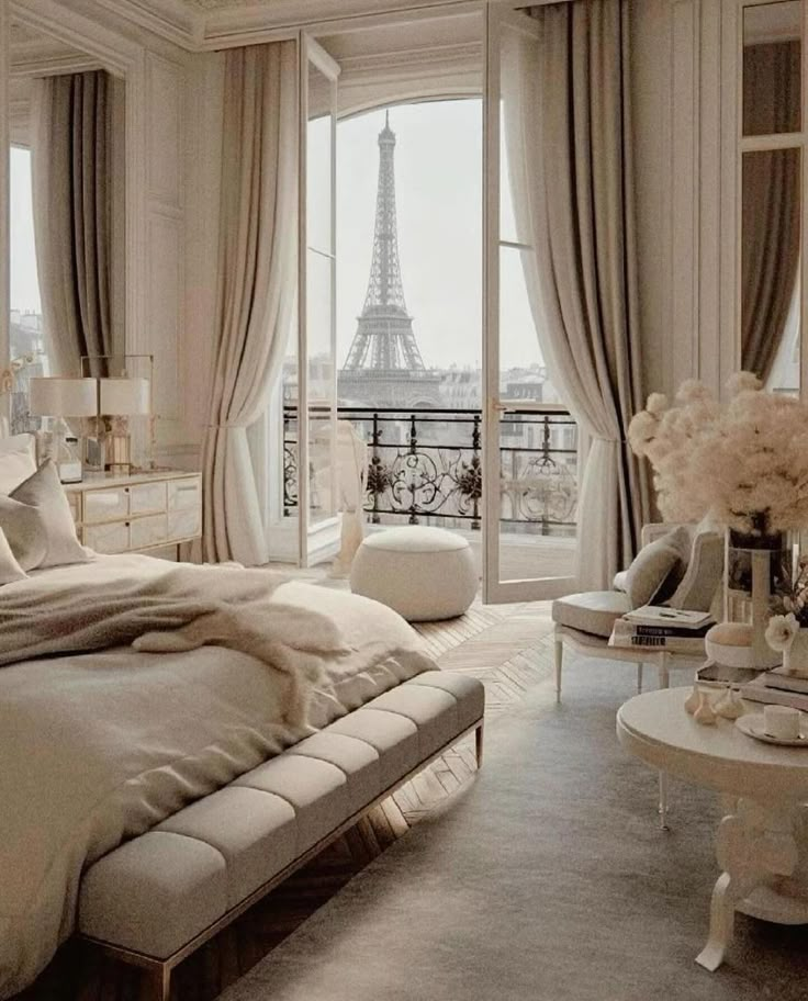 Luxurious Parisian bedroom with Eiffel Tower view through elegant French doors, chic decor, and soft lighting.