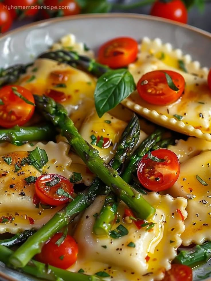 Delicious ravioli with asparagus, cherry tomatoes, and herbs on a plate. Fresh and vibrant Italian meal.