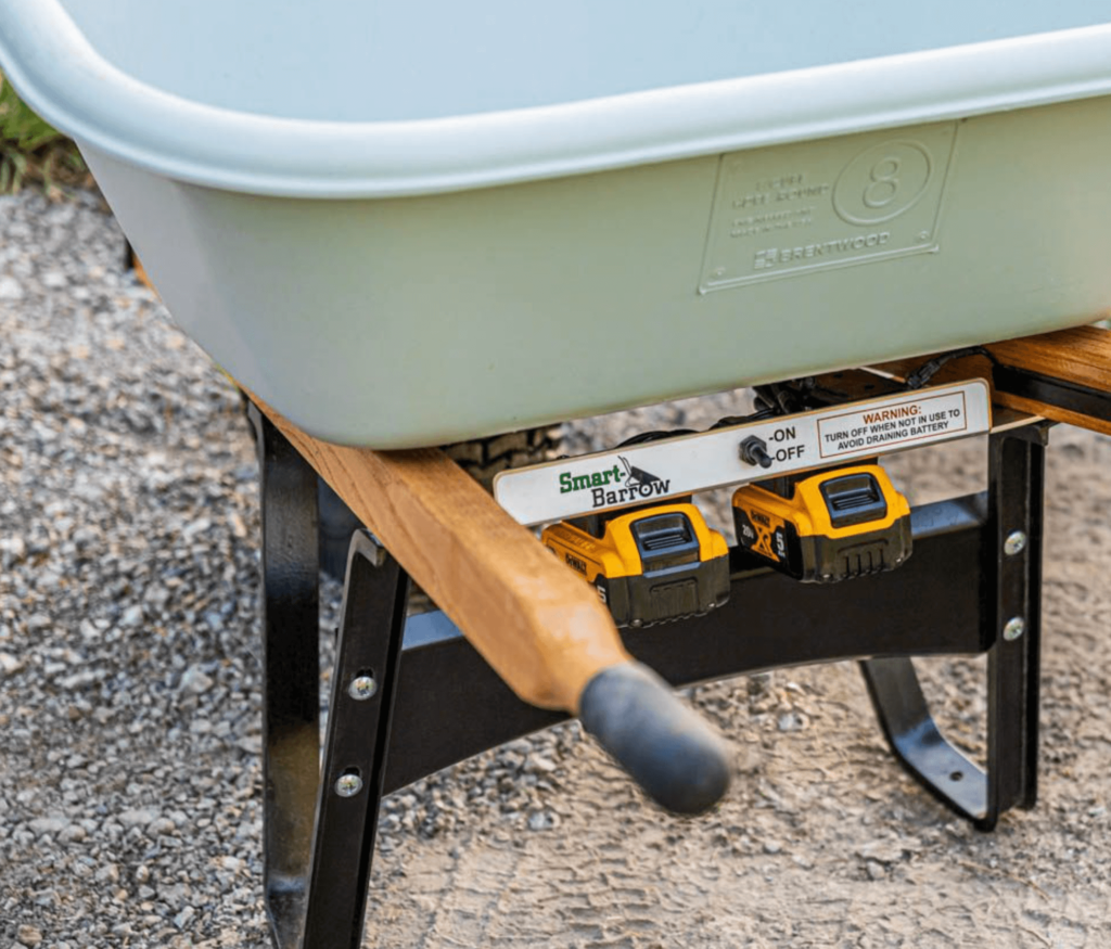 SmartBarrow with dual battery packs on a sturdy frame, parked on gravel.