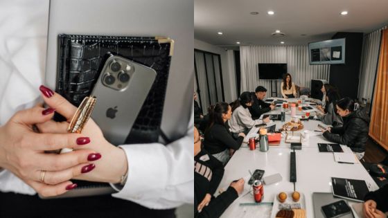 Business meeting with smartphones and documents around a conference table, showcasing teamwork and collaboration.