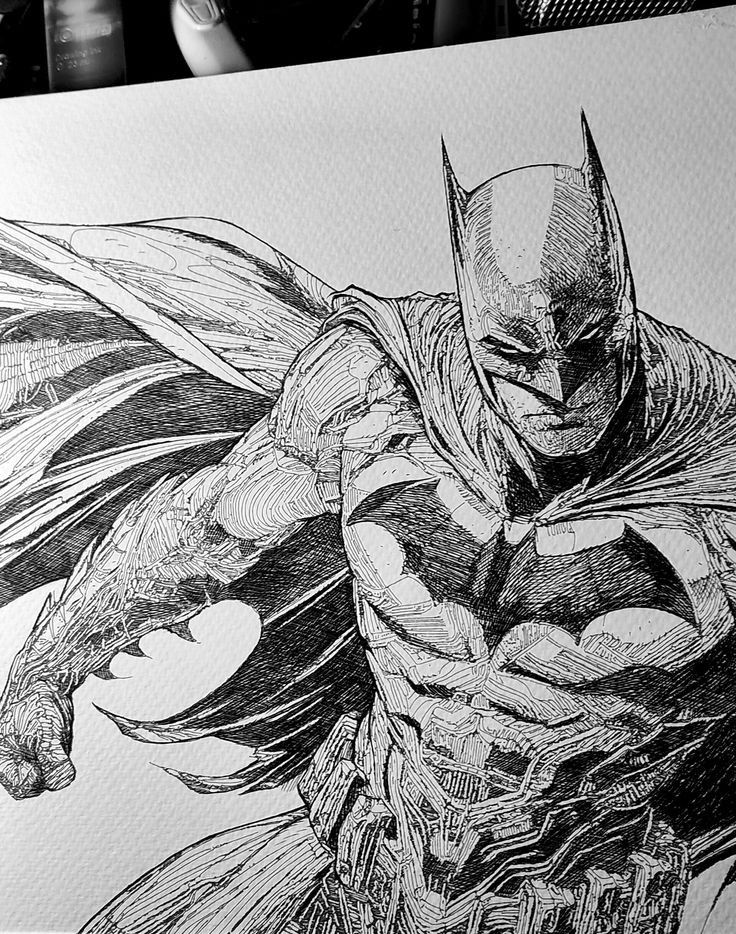 Detailed black and white ink drawing of a superhero in a cape, showing dynamic action and intricate design.