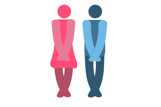 Gender symbols for restroom identification in pink and blue, standing with crossed legs against a colorful striped background.