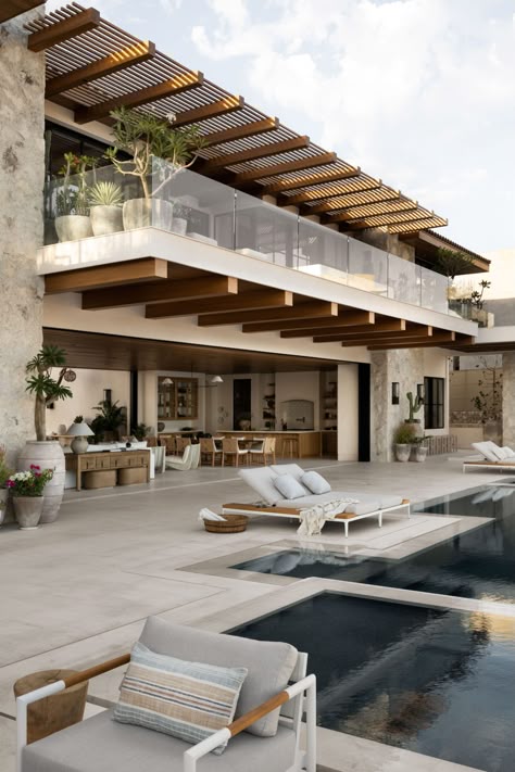 Modern luxury villa with outdoor pool, sun loungers, and terrace with plants and glass railing.