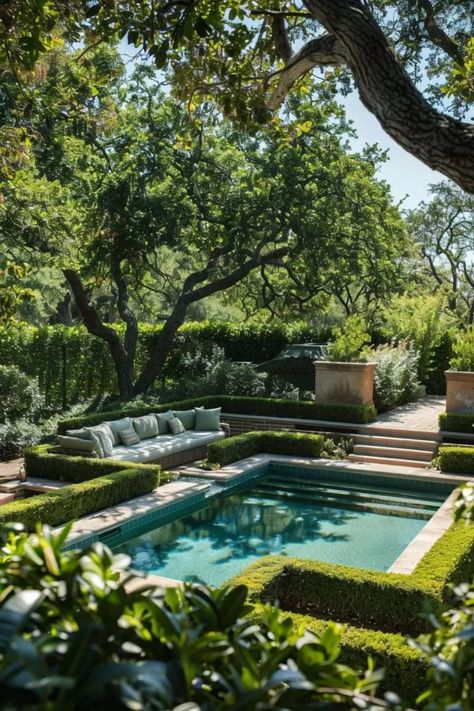 Luxurious garden with pool, surrounded by lush greenery and outdoor seating for relaxation.