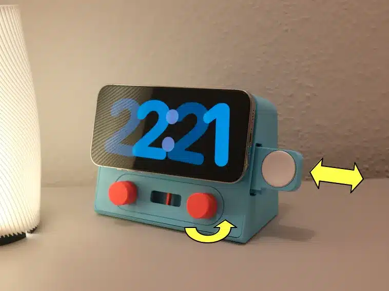 Retro-style smartphone dock with clock display, featuring red knobs and adjustable dial, next to a modern lamp.