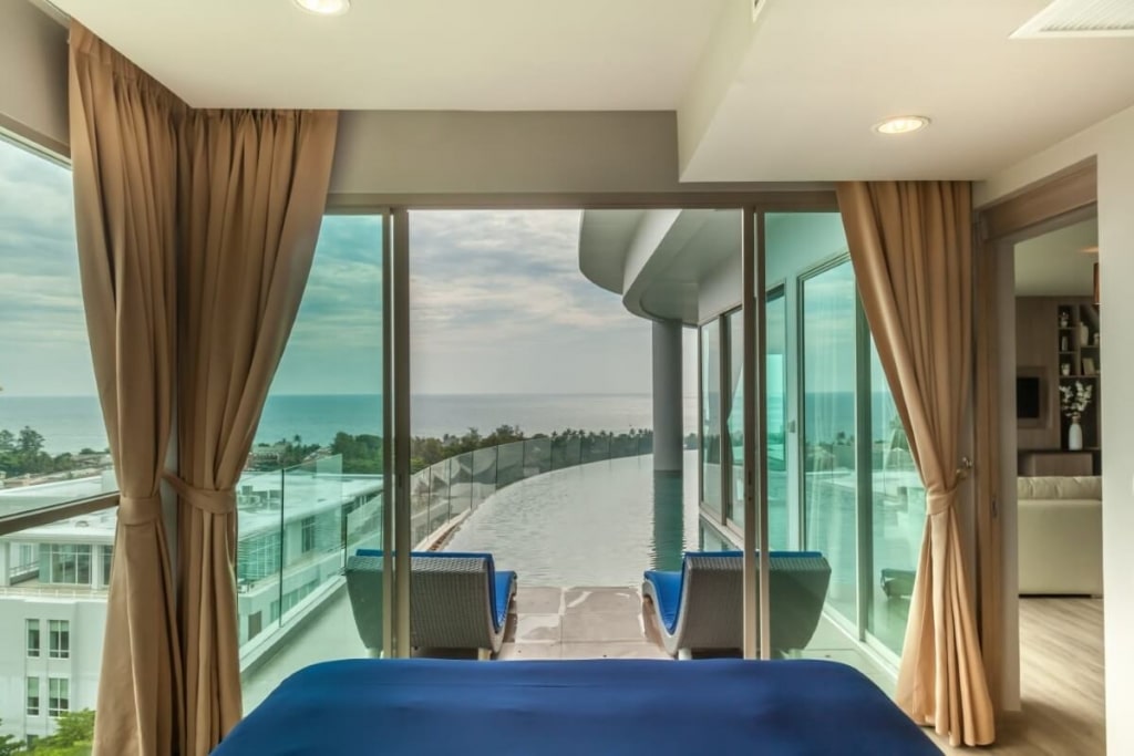 Luxury beachfront hotel suite with stunning ocean view and private balcony pool.