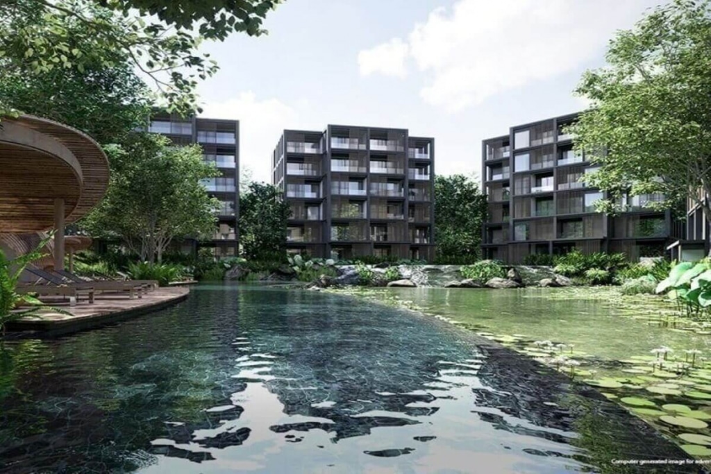 Modern apartments surrounded by lush greenery with a serene pond view.