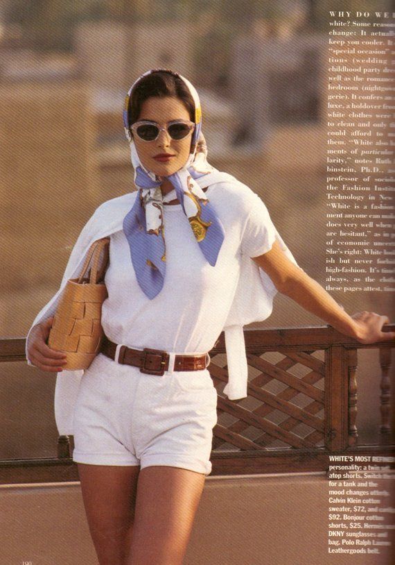 Fashionable woman in retro summer attire with headscarf, sunglasses, and wicker bag. Elegant and stylish vintage look.