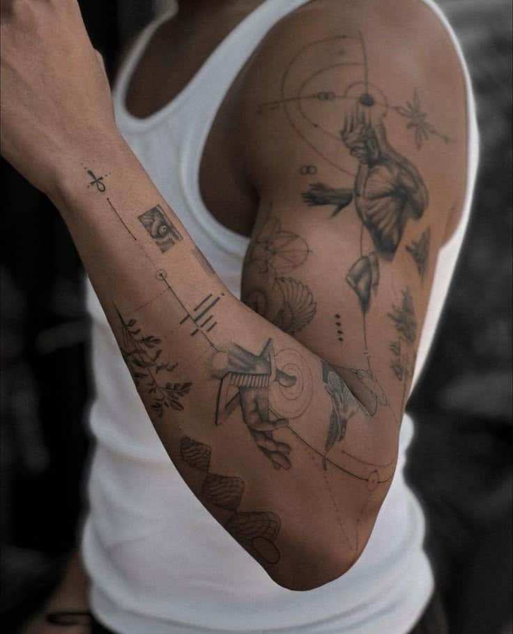 Arm with intricate black ink tattoos featuring abstract and geometric designs, wearing a white sleeveless shirt.