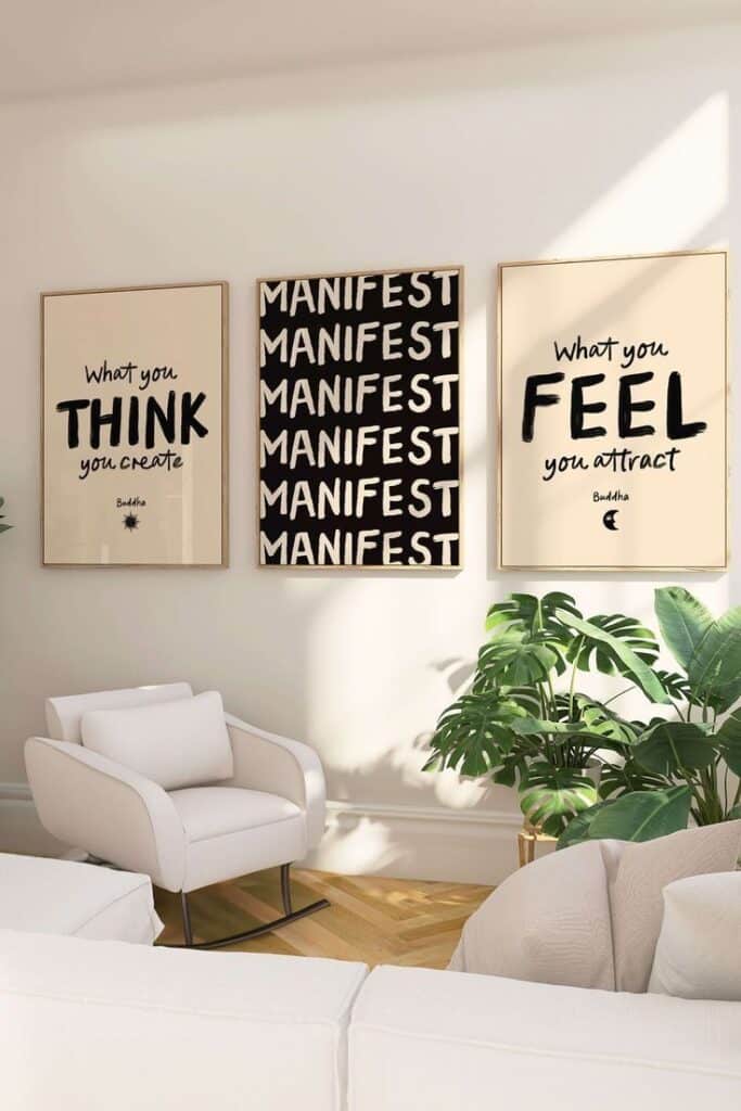 Minimalist living room with motivational wall art and lush houseplants. Cozy white chair for a serene atmosphere.