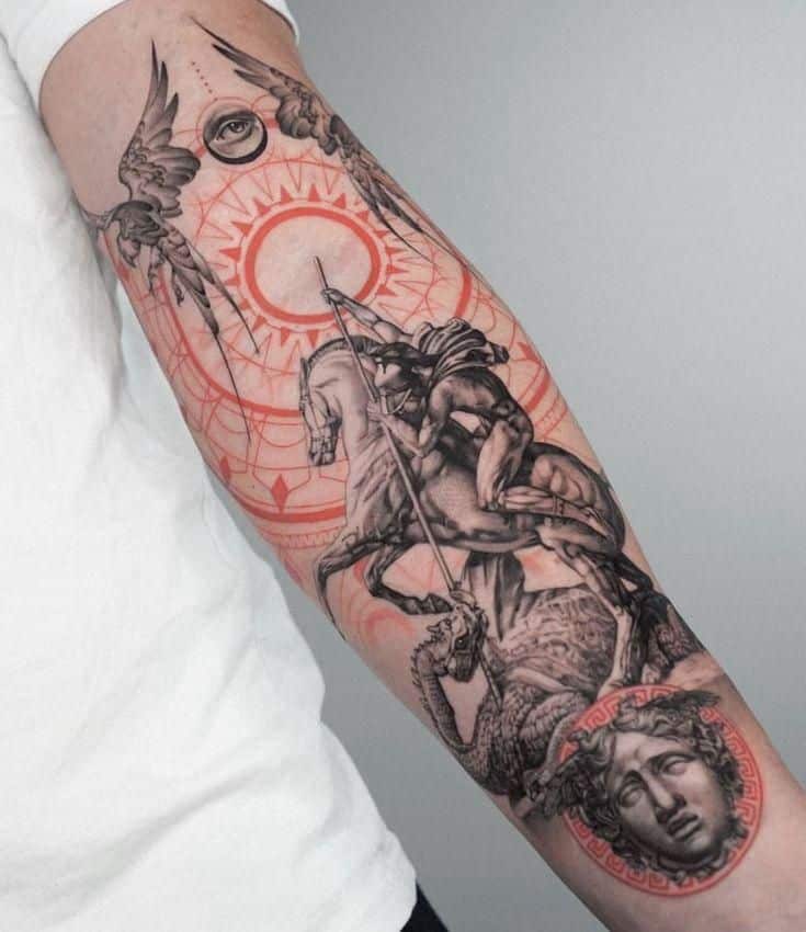 Forearm tattoo featuring a medieval knight on horseback, intricate designs, and a Medusa head in grayscale and red tones. Best Tattoos for Men