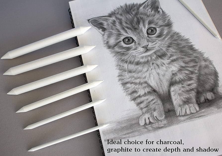 Sketch of a kitten with blending stumps for shading, perfect for charcoal and graphite art techniques.