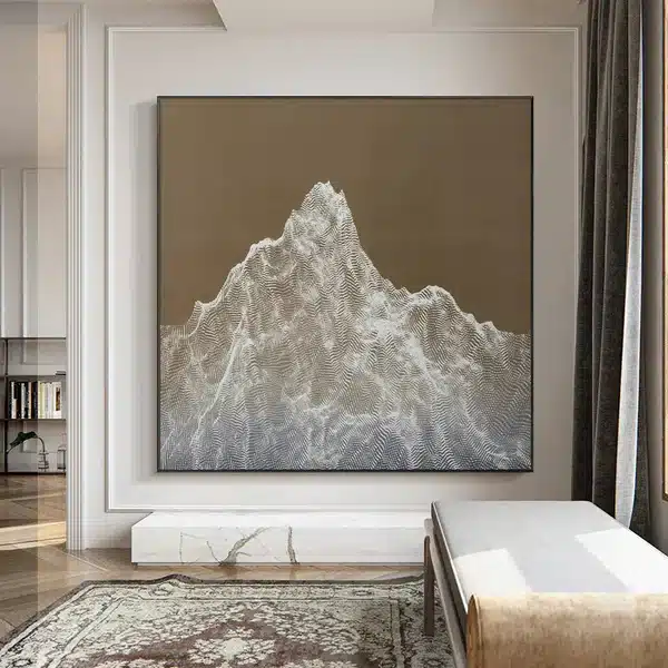 Modern abstract mountain painting on a wall in a stylish living room.
