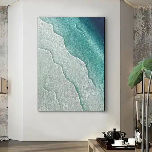 Abstract ocean-themed artwork on wall in modern living room with teaset and plant.