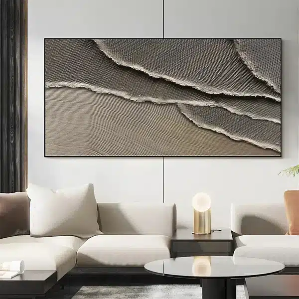Modern living room with abstract textured wall art, beige sofa, and stylish decor.