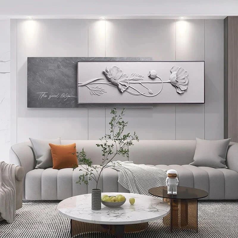 Modern living room with floral wall art, gray sofa, and stylish marble coffee table.