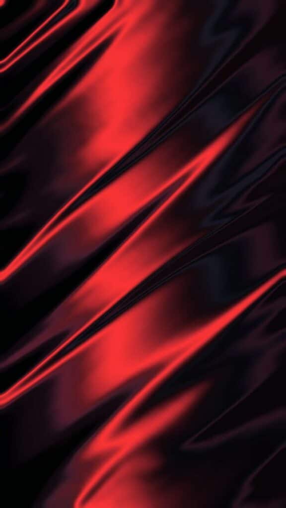 Abstract red and black wavy silk texture, creating a vibrant and elegant pattern for backgrounds.