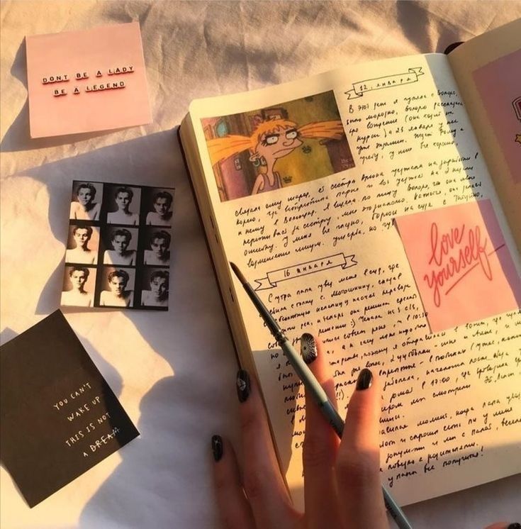 Creative journal page with notes, sketches, and inspiring quotes in sunlight.