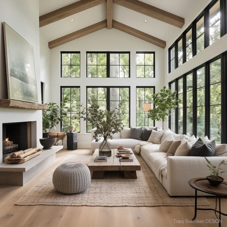 farmhouse-living-room-4 Modern living room with large windows, cozy white sofa, and elegant decor, featuring natural light and greenery. | Sky Rye Design Modern living room with large windows, cozy white sofa, and elegant decor, featuring natural light and greenery.