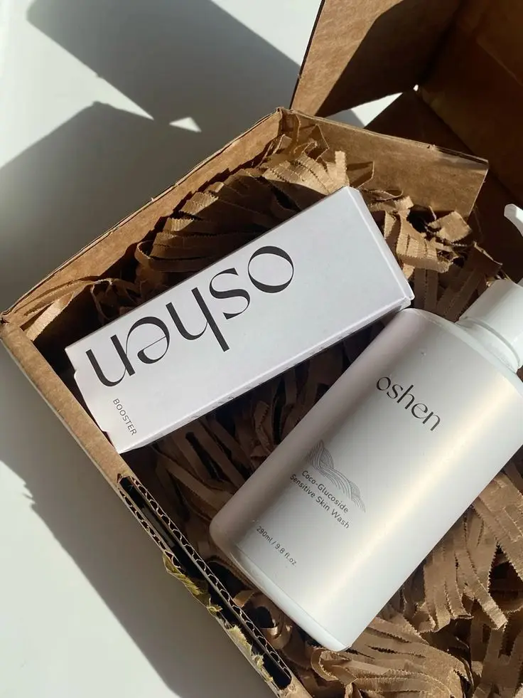 pr unboxing 🤍 Natural skincare gift box featuring Oshen booster and sensitive skin wash on brown paper filler. | Sky Rye Design Natural skincare gift box featuring Oshen booster and sensitive skin wash on brown paper filler.