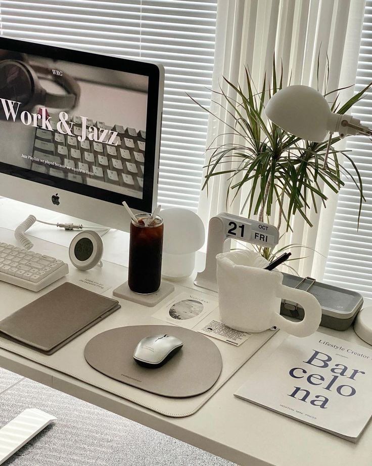✩ ° ⋆ 🎧 Modern workspace with computer, plant, coffee, and calendar on a bright desk setup. Minimalist office inspiration. | Sky Rye Design Modern workspace with computer, plant, coffee, and calendar on a bright desk setup. Minimalist office inspiration.