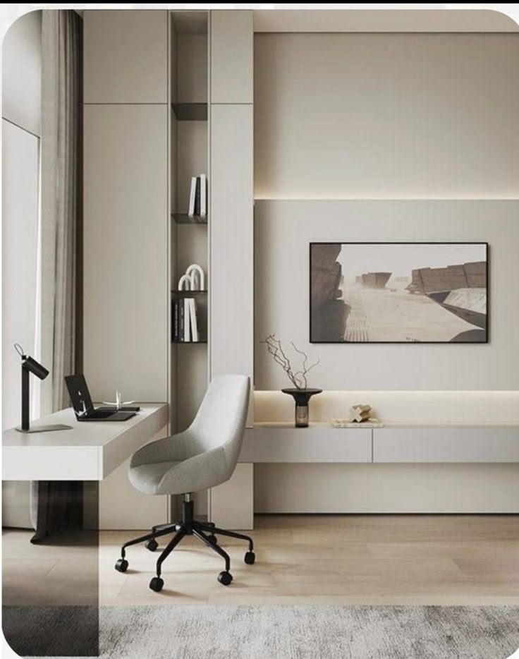 Modern minimalist home office with sleek desk, grey chair, artwork, and shelves for elegant workspace design.