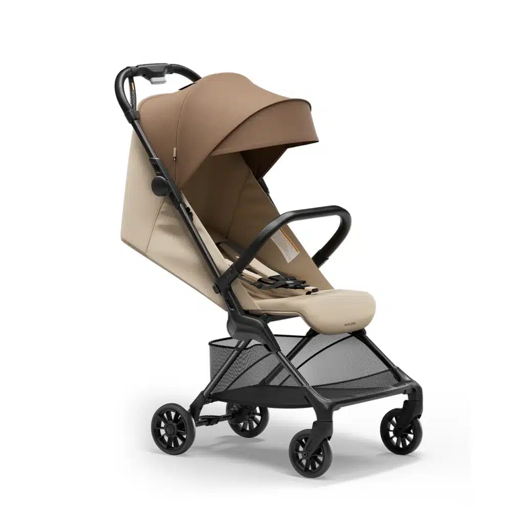 Lightweight beige baby stroller with brown canopy, black frame, and storage basket, ideal for travel and urban use.