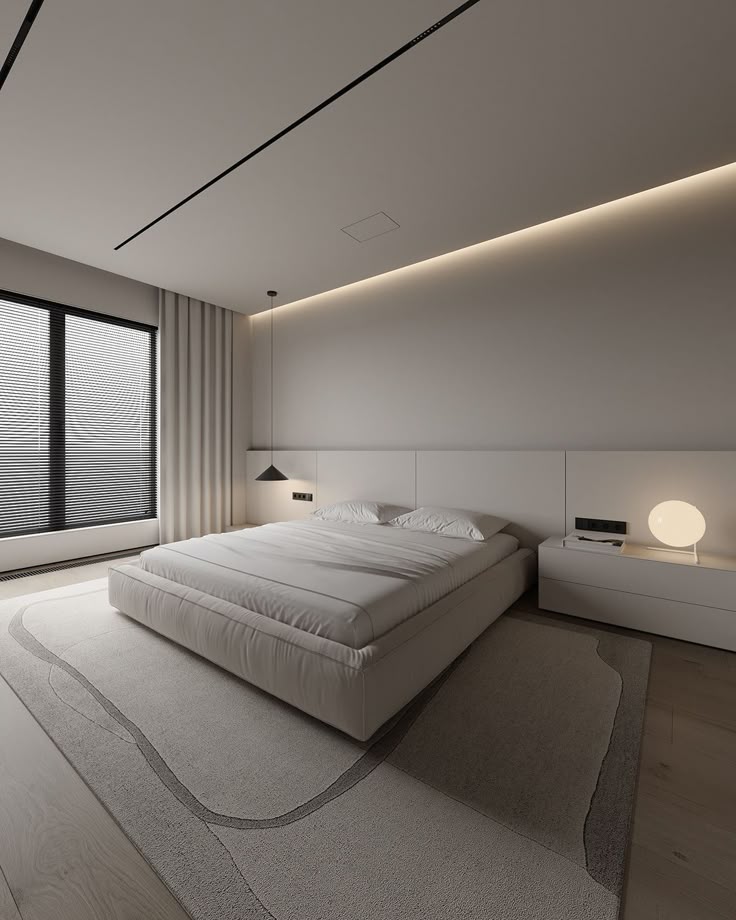 Modern minimalist bedroom with elegant lighting, comfortable white bedding, and sleek decor.