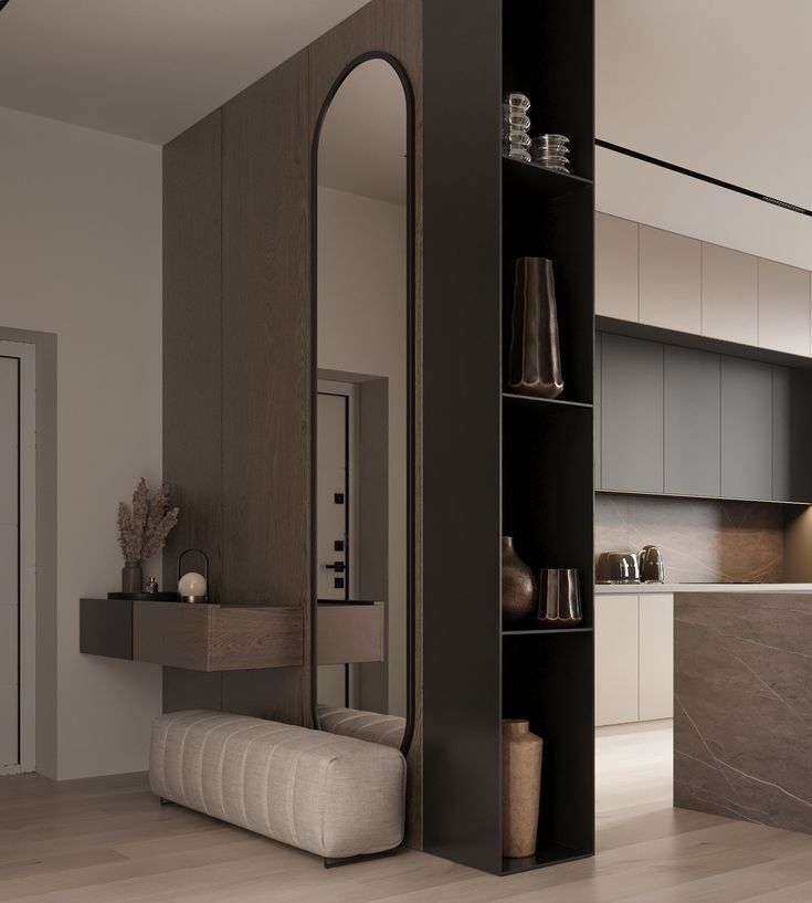 Modern minimalist interior with wooden accents, cozy seating, shelves, and decorative vases in a neutral color scheme.