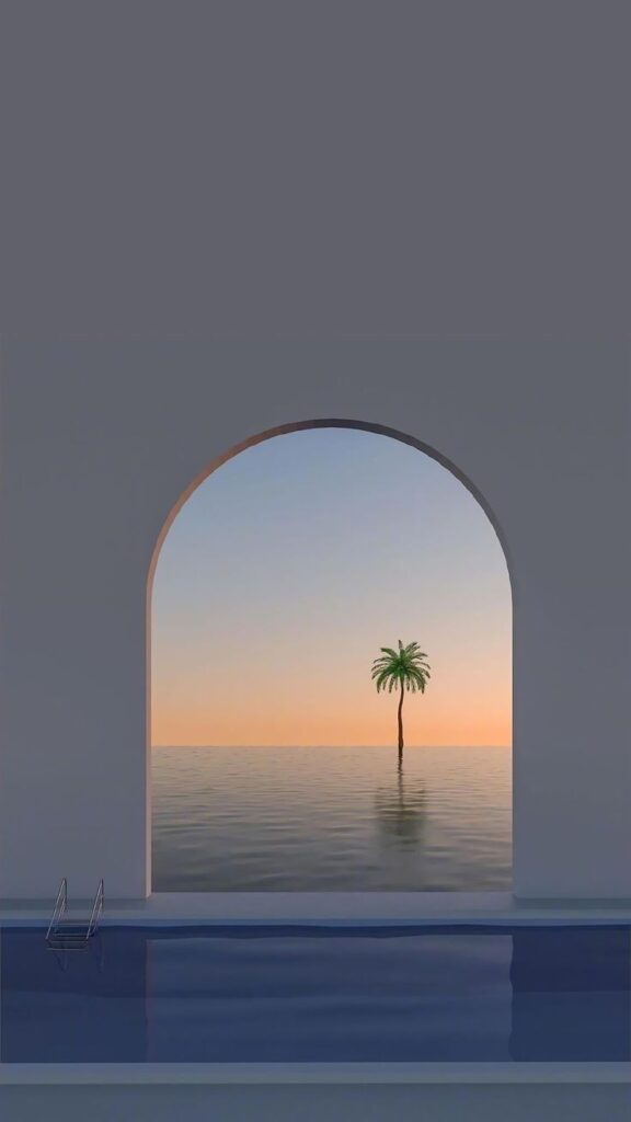 Sunset view of an ocean through an archway, with a single palm tree on the horizon, above a tranquil pool.