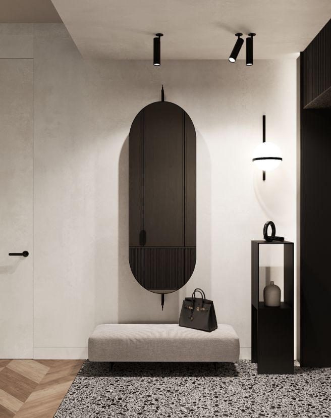 Modern hallway with minimalist decor featuring a gray bench, black cabinet, and elegant lighting.