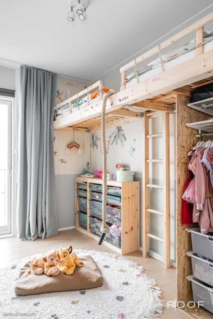 Children's room with loft bed, storage, and playful decor; modern and cozy space with rope swing and soft toys.