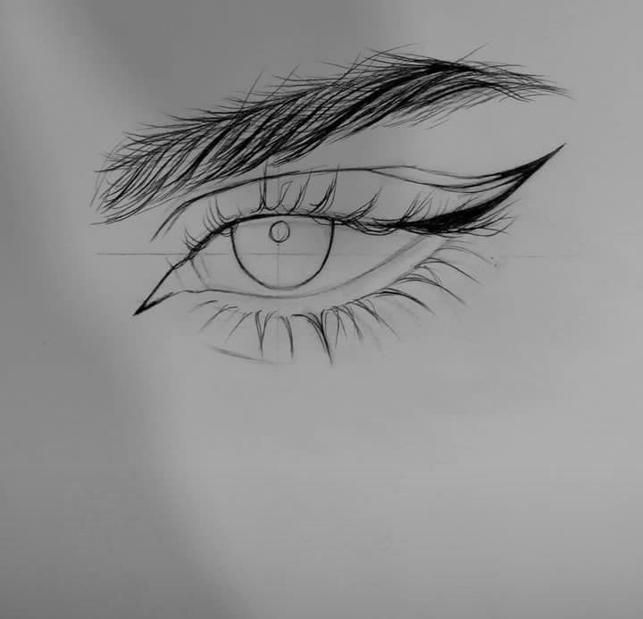 Sketch of a detailed human eye with bold eyeliner, focusing on lashes and brow, drawn on white paper.