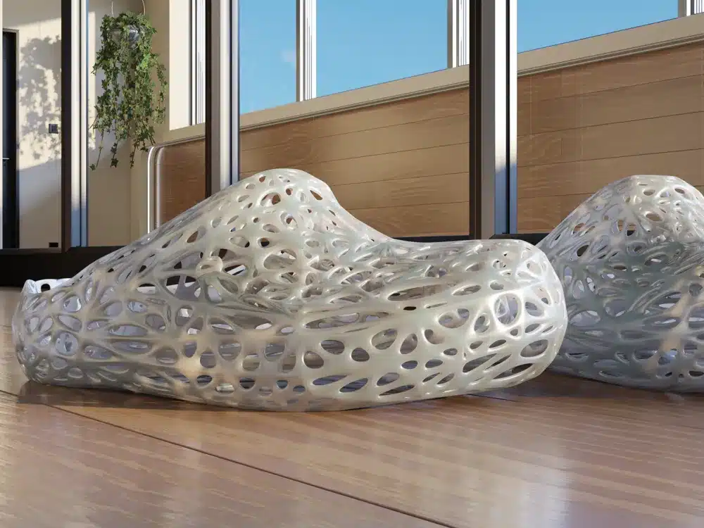 Modern artistic furniture with intricate, lattice design sits in sunlit room, blending style and nature-inspired aesthetics.