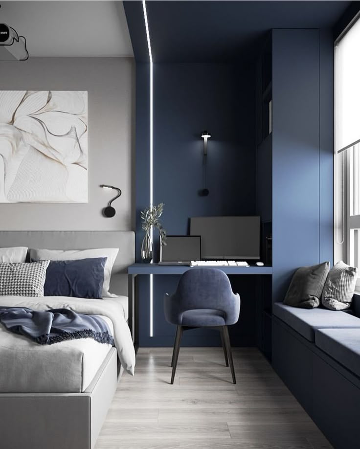 Modern bedroom with blue and gray decor, desk with chair, art on wall, and a cozy window seat.