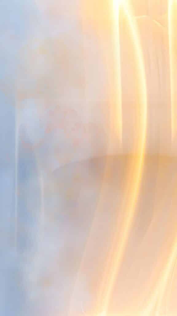 Abstract light streaks with soft pastel colors, creating a soothing and ethereal visual effect.