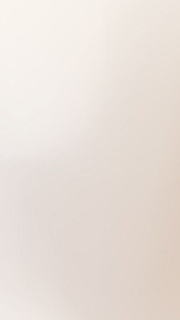 Plain beige background, ideal for minimalist design or text overlay.