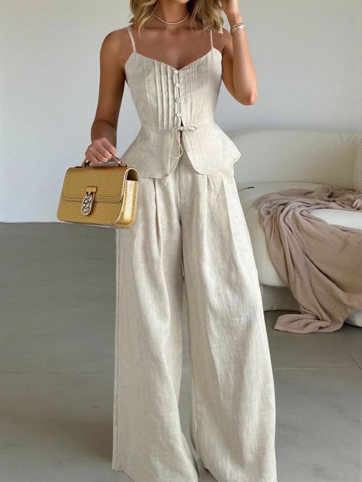 Woman in chic beige linen outfit with button corset top and wide-legged pants, accessorized with yellow handbag. Simple Summer Outfits