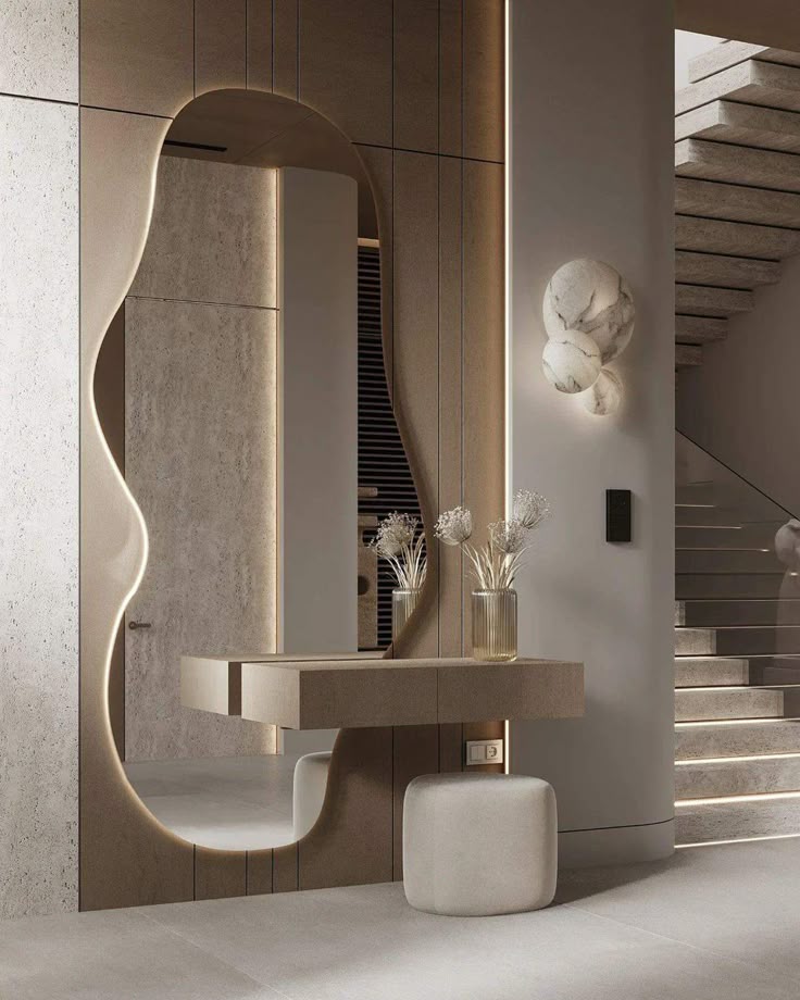 Modern hallway with abstract mirror, sleek console table, decorative vase, and minimalist staircase. Elegant interior design.