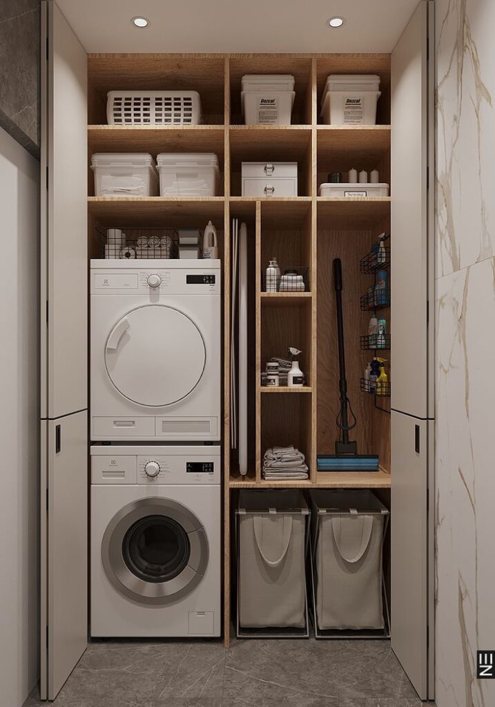 Modern laundry room with stacked washer and dryer, organized shelves, and laundry baskets.