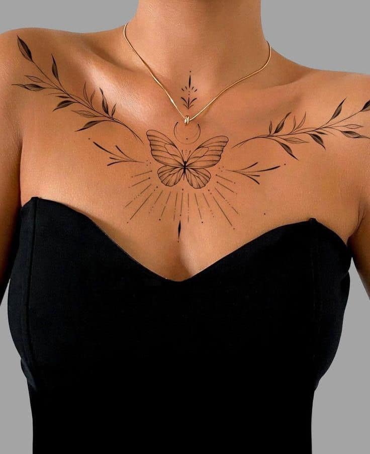 281a88cdc46227a048c8d175bf8936ea Chest tattoo featuring a butterfly and leaves design with gold necklace, worn with a black strapless top. | Sky Rye Design Chest tattoo featuring a butterfly and leaves design with gold necklace, worn with a black strapless top.