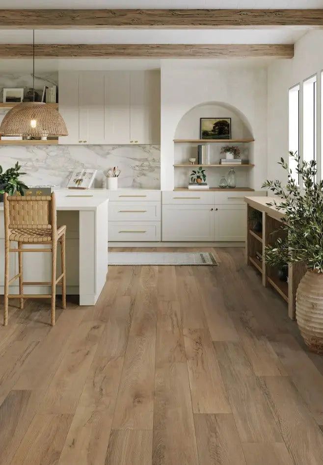 Modern kitchen with wood flooring, white cabinets, open shelves, and rattan accents under natural light.
