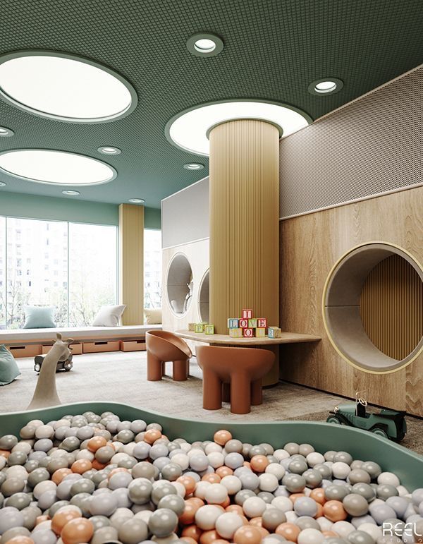 Modern kids playroom with a ball pit, circular windows, pastel colors, and cozy seating.