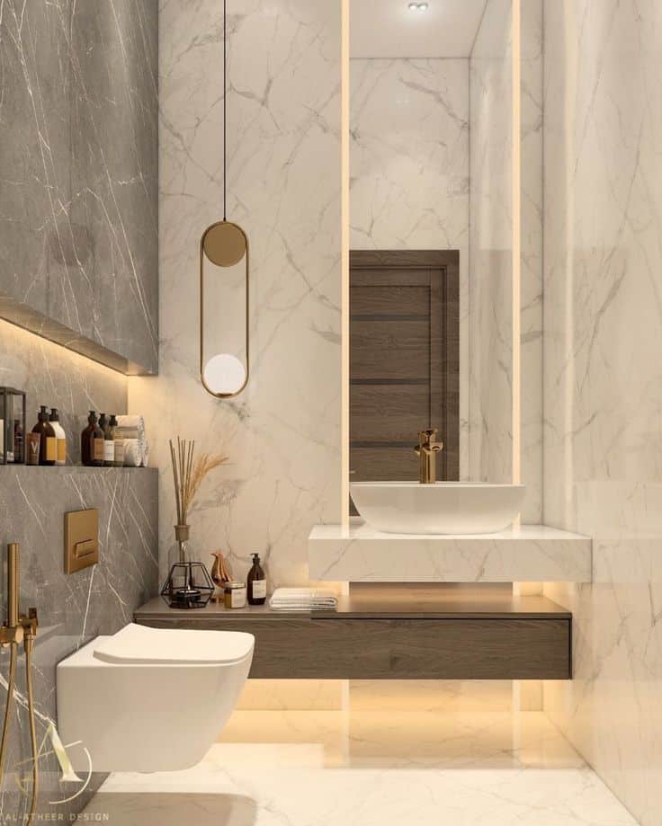Modern luxury bathroom with marble tiles, elegant sink, and stylish lighting accents for a sophisticated design.