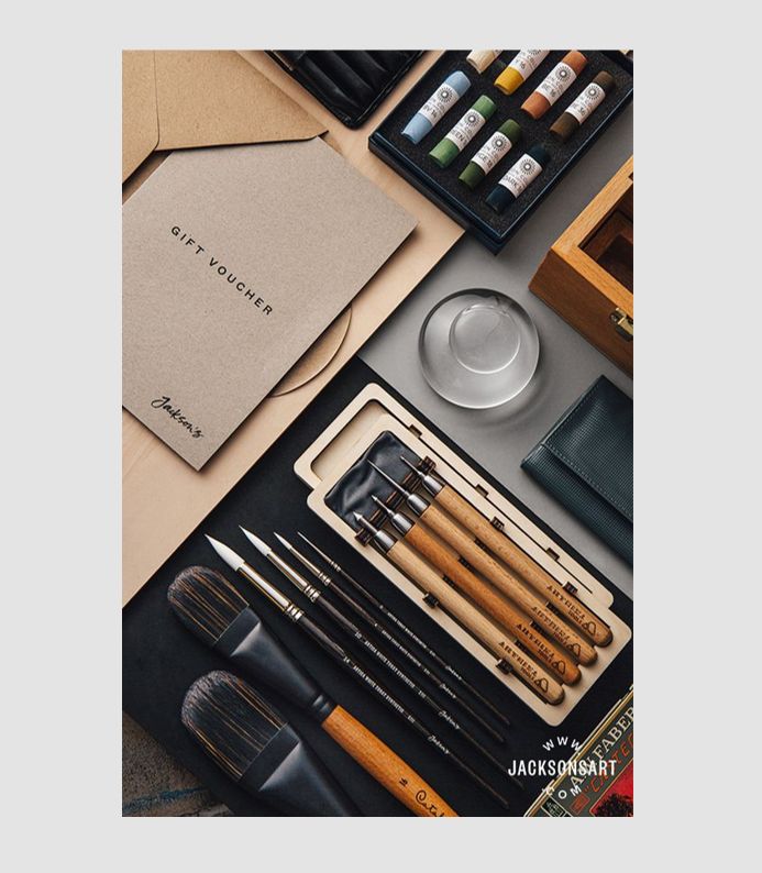 39c57bff-fb3f-4ce2-ad38-da43bb84d96e Art supplies including brushes, paints, and a gift voucher displayed on a table. Perfect for artists and creatives. | Sky Rye Design Art supplies including brushes, paints, and a gift voucher displayed on a table. Perfect for artists and creatives.